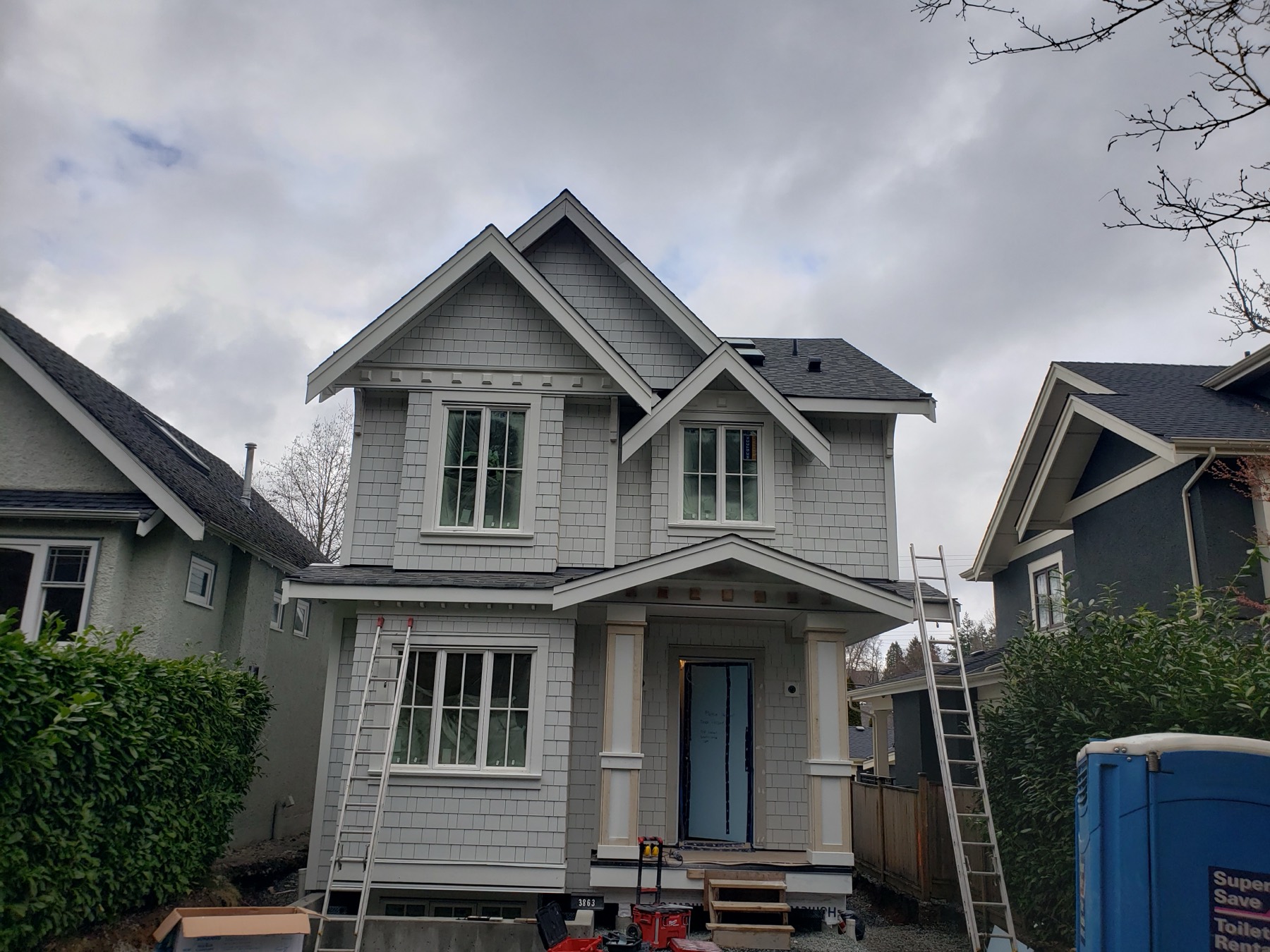 A grey home with white trim