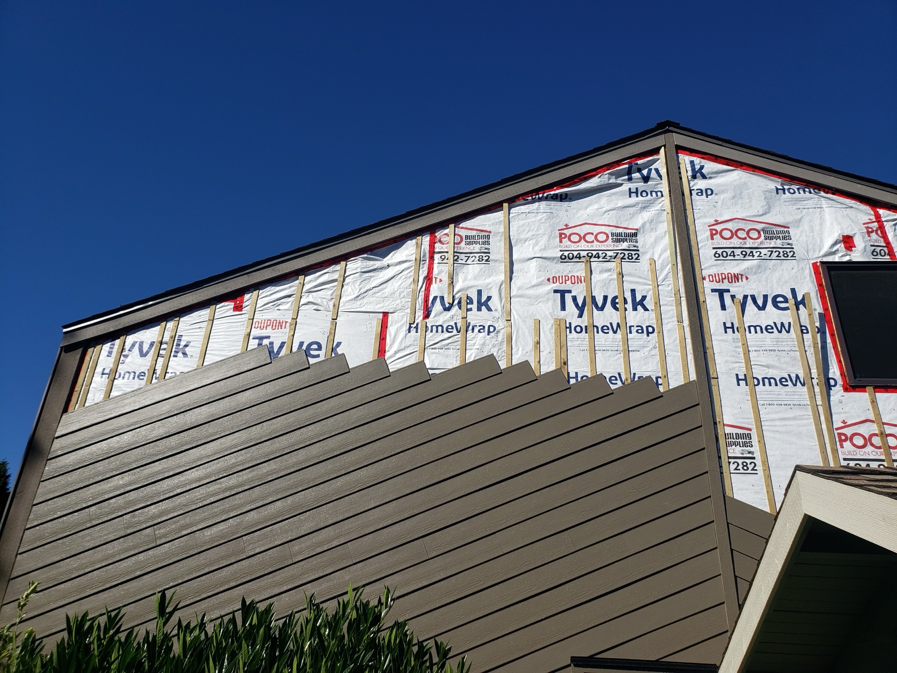 A house wrapped in weather barrier before cladding goes on