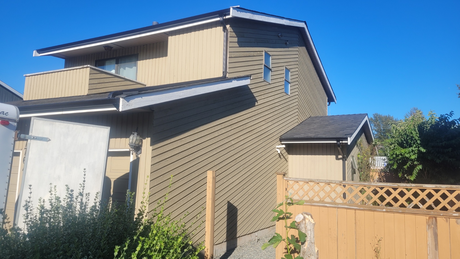 A modern home with dark cladding